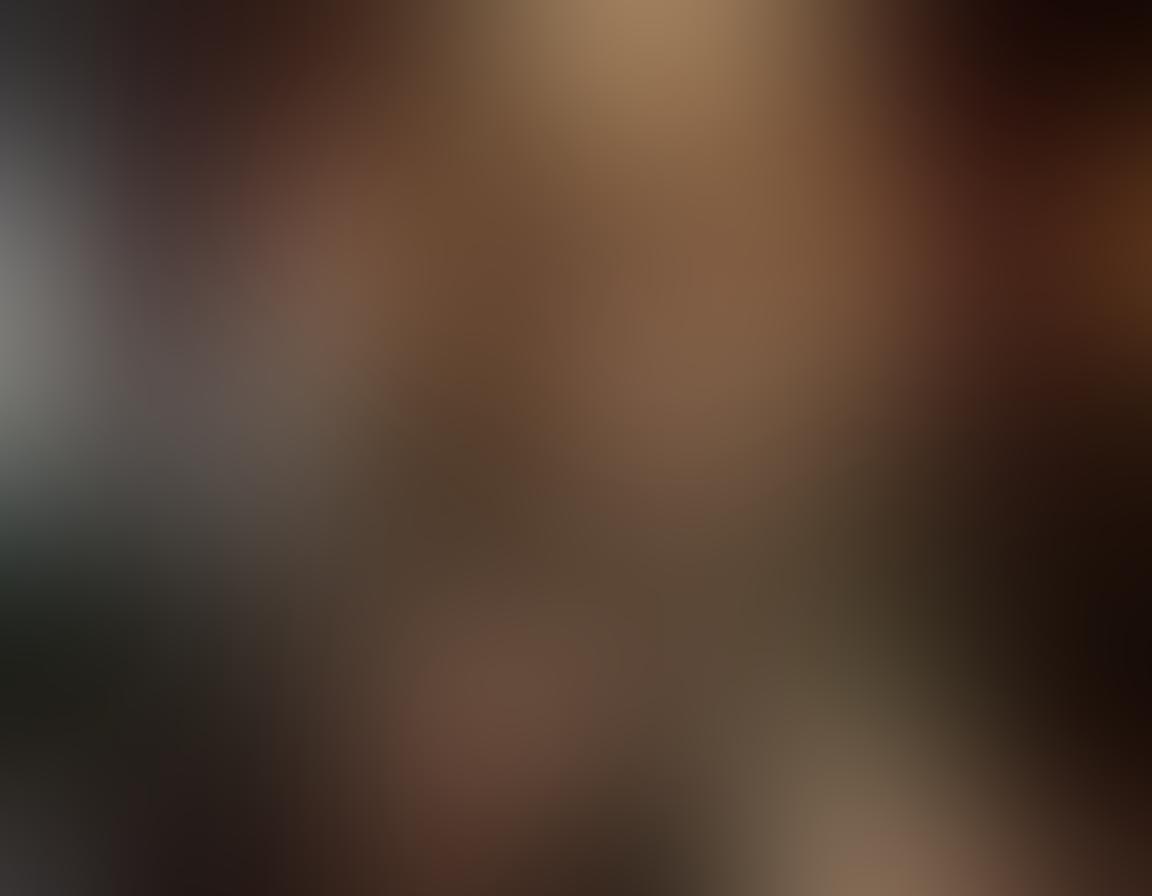 A glamorous scene featuring a blonde woman in an elegant pose, surrounded by soft lighting and luxurious decor that exudes sensuality. The background should include elements like velvet drapes and glimmering chandeliers, creating an alluring atmosphere. She can be dressed in chic, fashionable lingerie, with a confident yet playful expression. Incorporate vibrant colors to enhance the allure, capturing the essence of beauty and seduction. super-realistic. vibrant colors. luxurious setting.